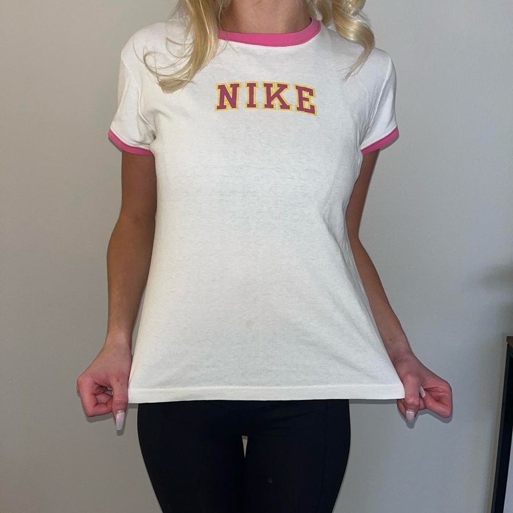 Vintage Nike short sleeve t shirt in white with pink lettering and trim. Large